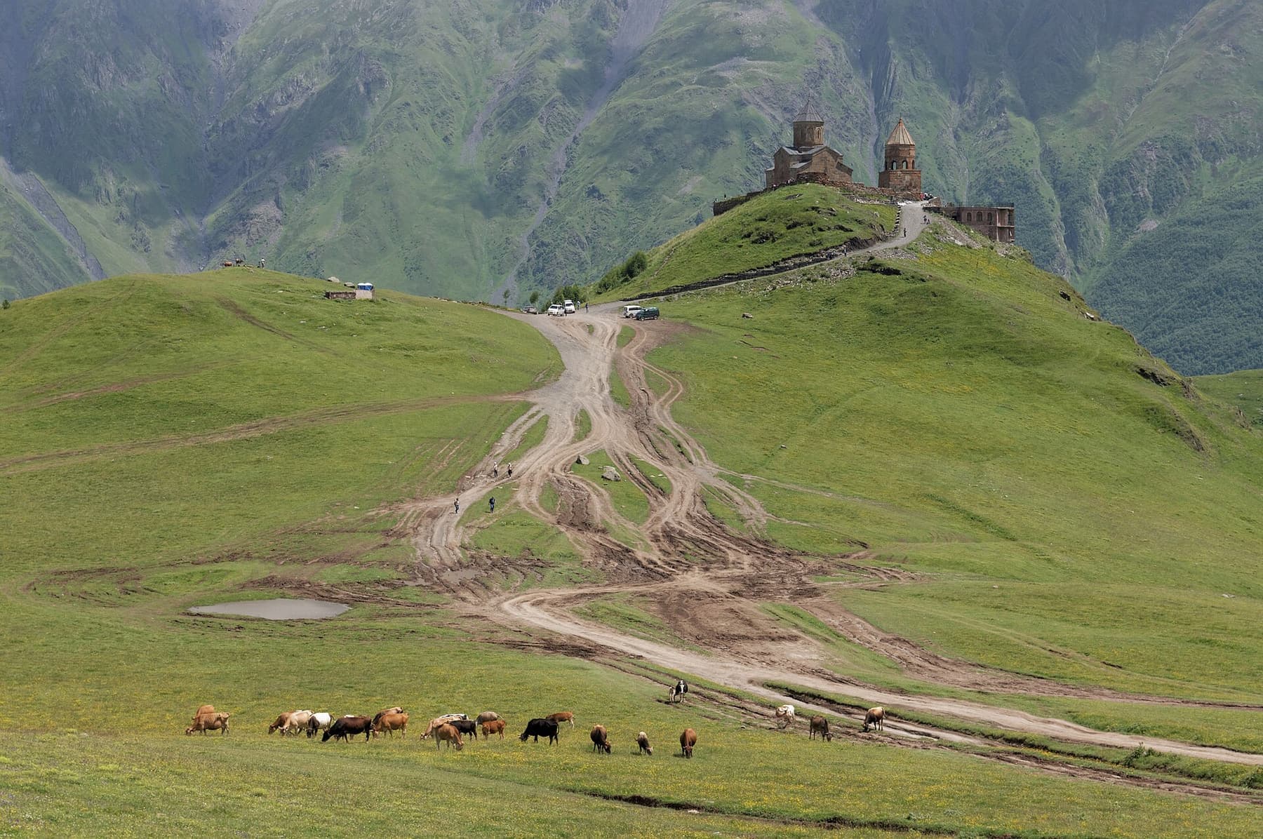 A Georgian church standing on mountain pasture